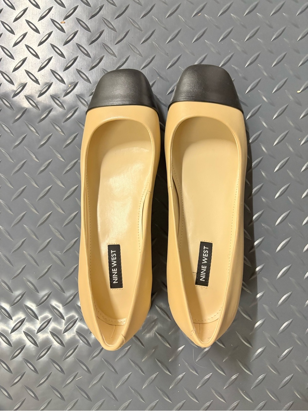 Nine West Beige with Black Cap Toe and heels